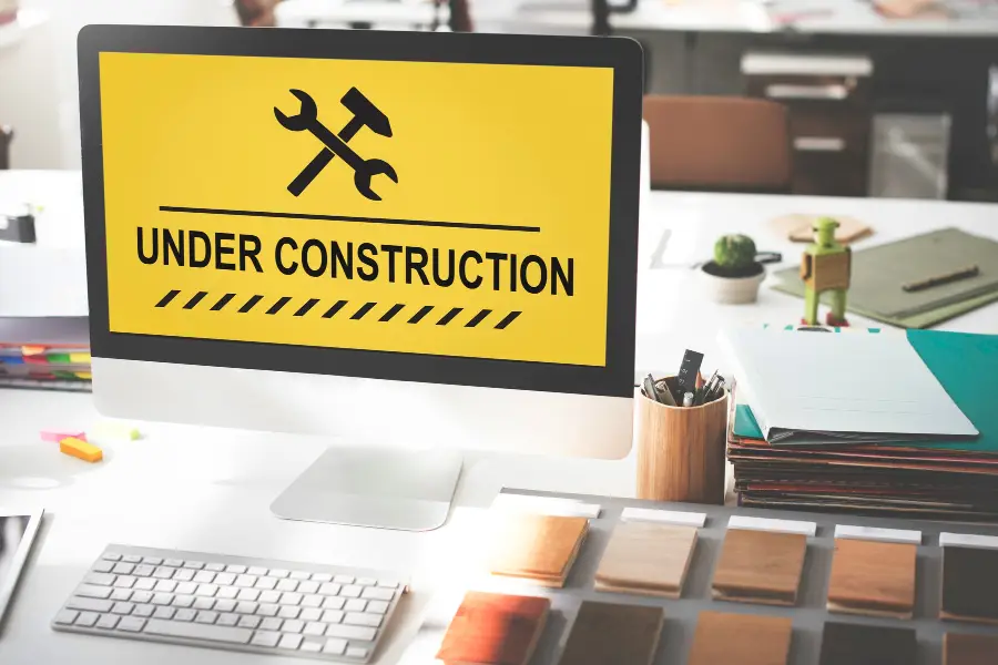 Illustration of an under construction warning sign icon, symbolizing the concept of regular website maintenance, aligned with the article 'Unlocking the Power of Regular Website Maintenance: Why It's Essential for Online Success, touchvision.site